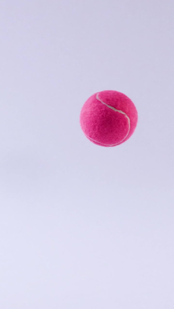 A tennis ball bounces on a surface