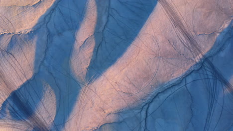 Aerial-View-Of-Utah-Badlands-With-Tire-Tracks