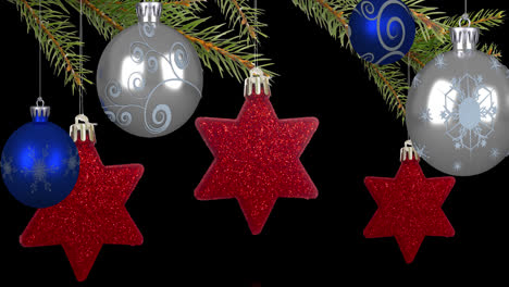 animation of christmas blue and silver baubles and red star decorations hanging from fir tree