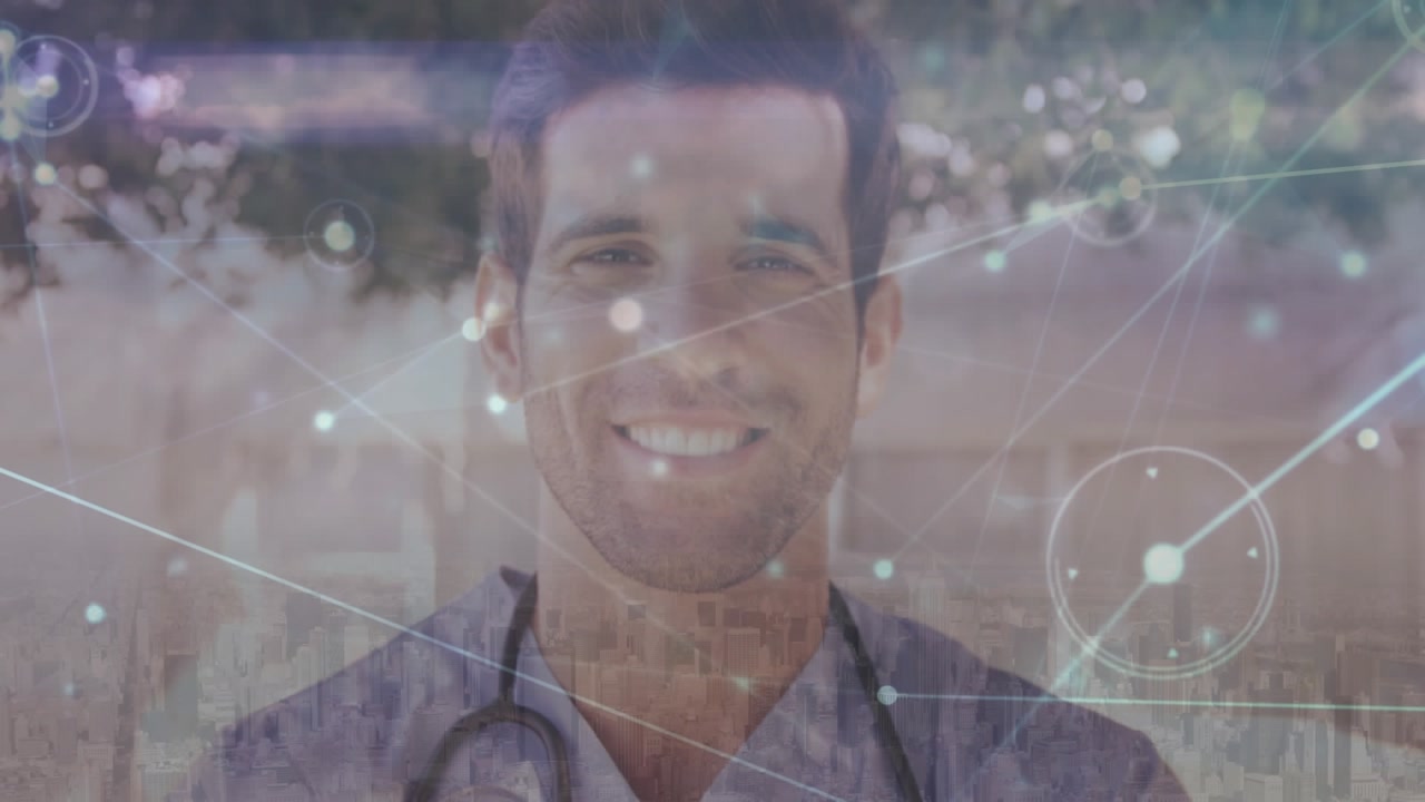 This video shows a doctor smiling in a hospital backyard