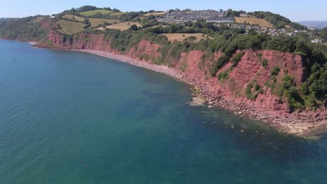 4K-Aerial-forward-shot-of-Ness-Cover-In-Shaldon-On-South-Devon-Coast,-England