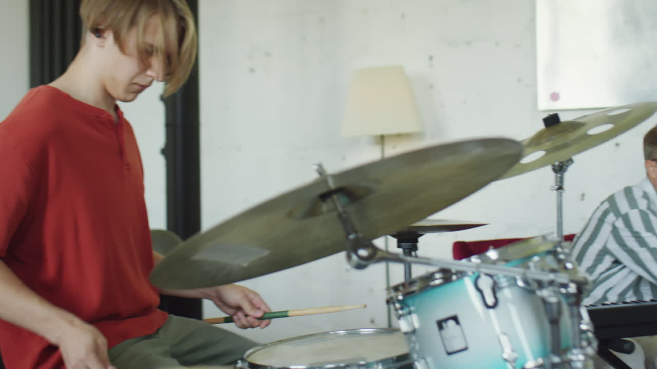 Young man playing the drum set