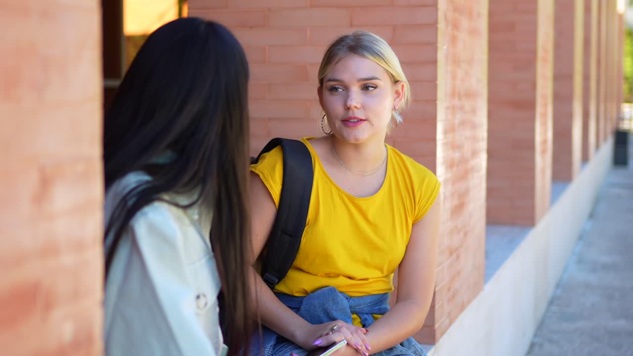 Two female students talking on campus