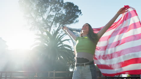 Woman holding American flag in celebration