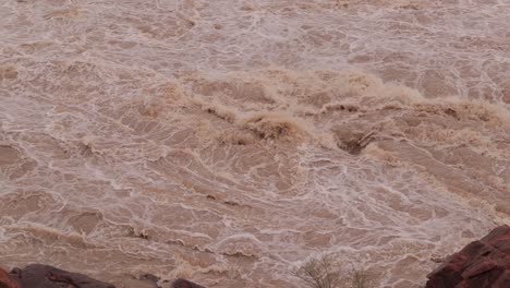 Flood-water-hitting-rocks-after-heavy-rain-in-Karnataka,-India