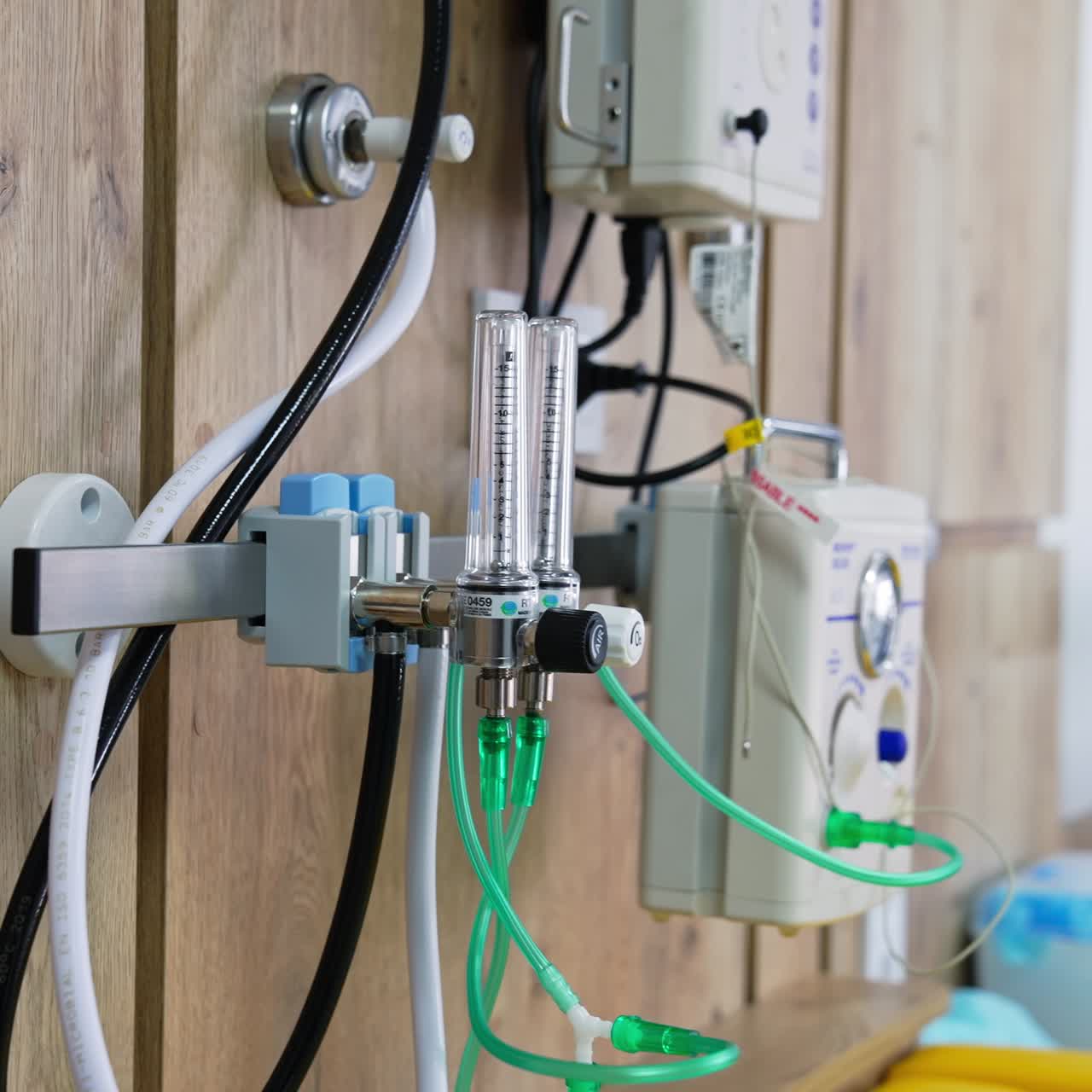 Advanced technological equipment with numerous tubes attached to a wall. Modern delivery room in maternity hospital