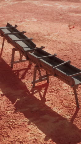 wooden trough in a desert landscape