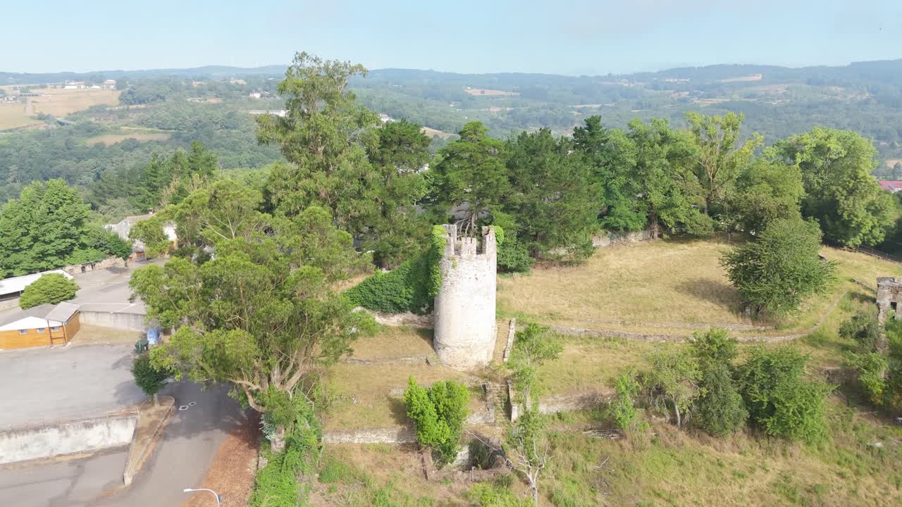 Aerial pullback view of Tower of Battalions, the remains of the fortification Of Sarria, Spain