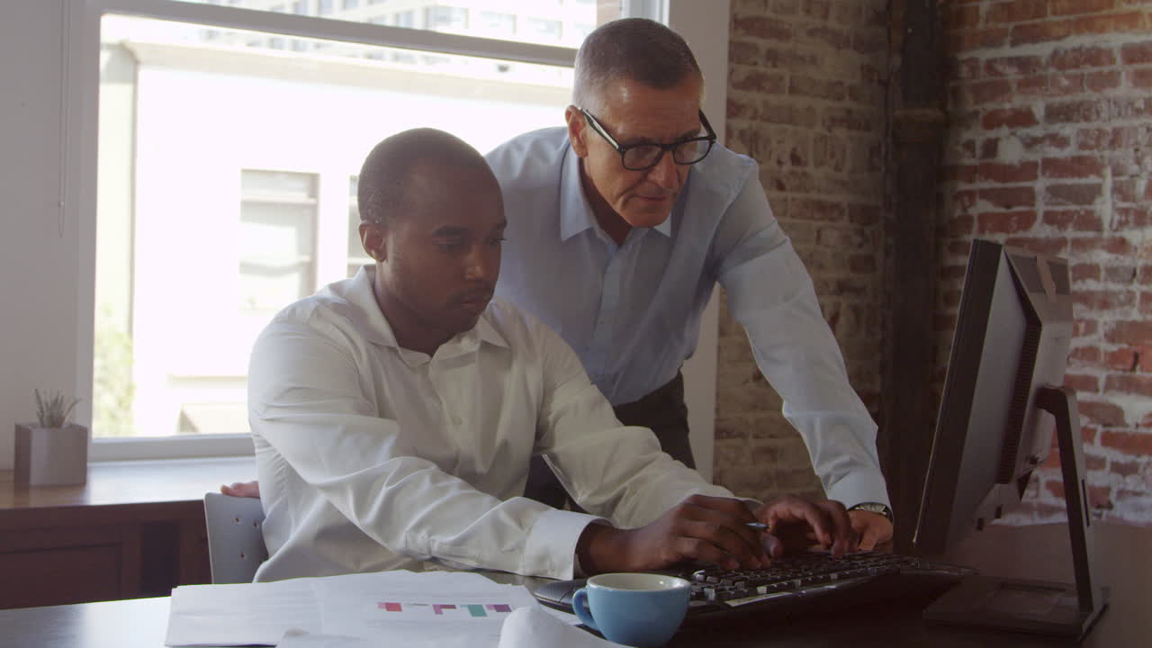 Trainee And Businessman Work On Computer Shot On R3D