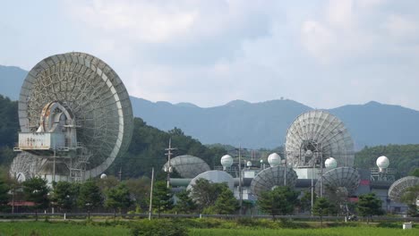 kt sat - kumsan satellite center at daytime with mountain views in the background in kumsan, south korea