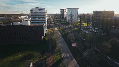 Aerial-hyperlapse-showing-buildings,-cars-and-city-landscape