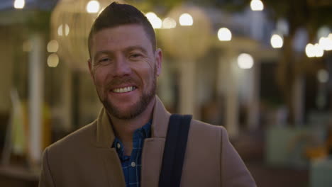 portrait confident businessman smiling happy enjoying successful urban lifestyle on relaxed urban evening in city slow motion