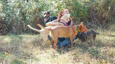 a woman and her dogs enjoying a playful day outdoors