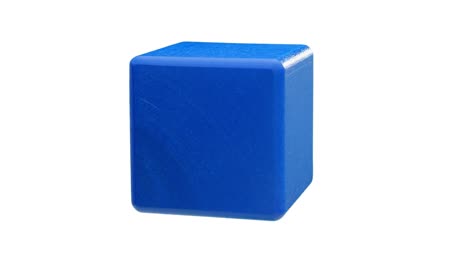 wooden blue cube isolated. looped rotation.