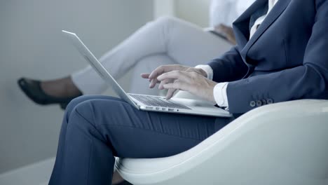 woman typing on laptop computer