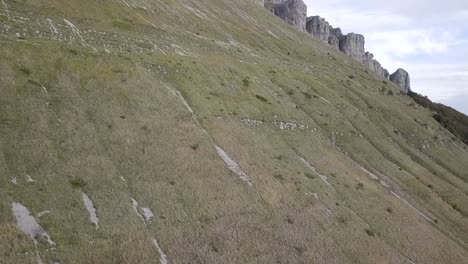 Soaring-over-steep-grasslands-in-France,-Parc-naturel-régional-du-Vercors