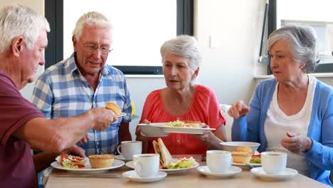 senior citizens having breakfast