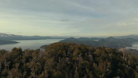 aerial dolly right shot of lakes and mountains near bariloche city in argentinian patagonia