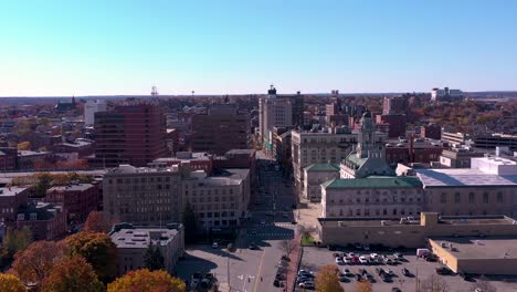 drone flying towards city hall on congress street in portland, maine