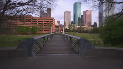 establishing shot of bridge crossing over buffalo bayou in houston