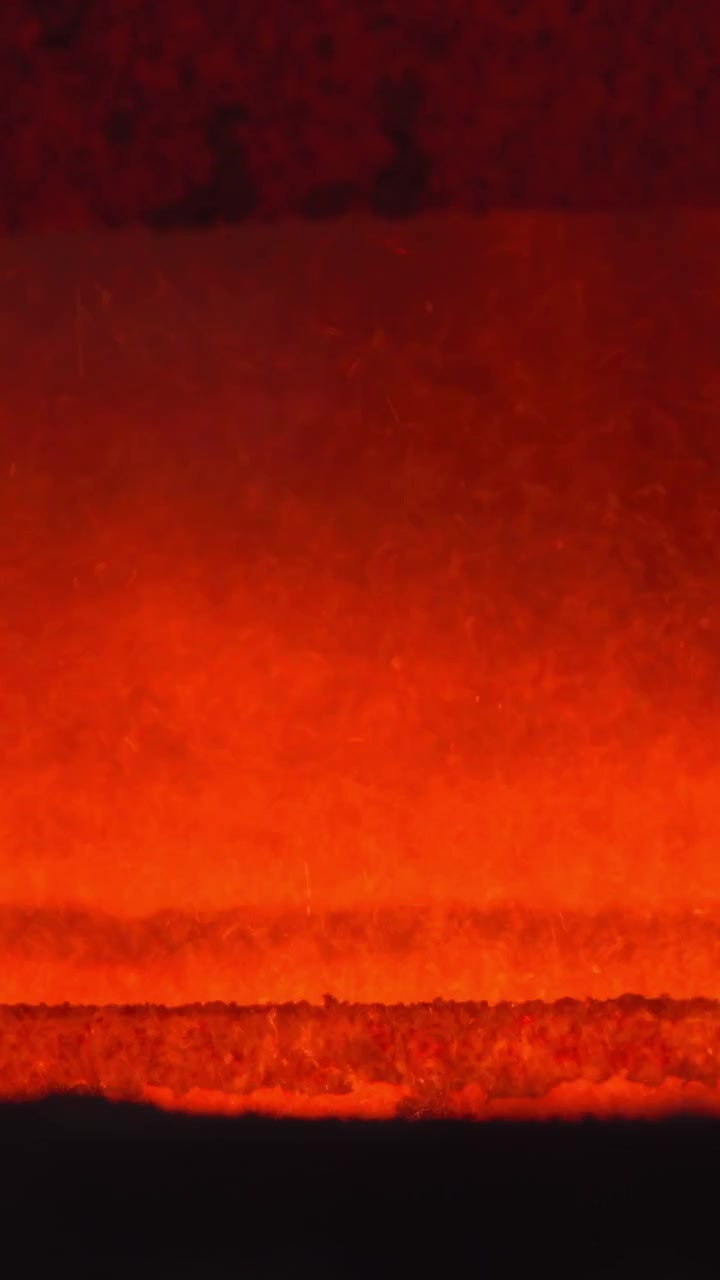 Molten Surface With Rising Vapor Plumes And Intermittent Bubbles, Orange Shimmer And Heat Haze, Industrial