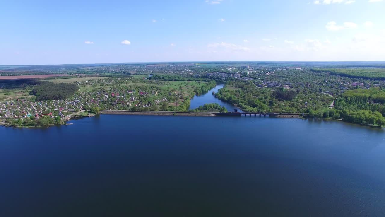 Dam blocking the river. Panoramic view of old dam near country