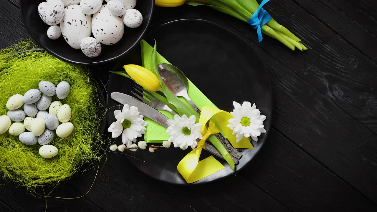 Easter spring table dishware composition with yellow tulip flower