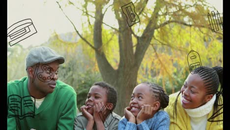 animation of school icons moving over african american parents with son and daughter in park