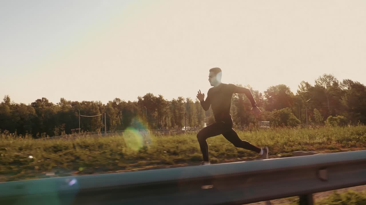 Man Running on a Road at Sunset