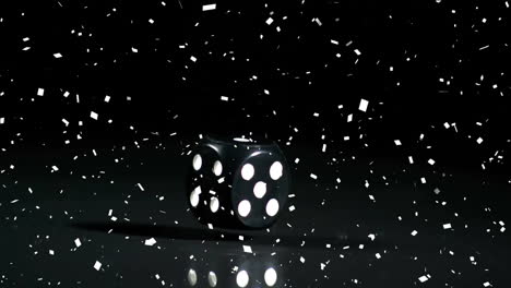 animation of black dice and confetti on black background