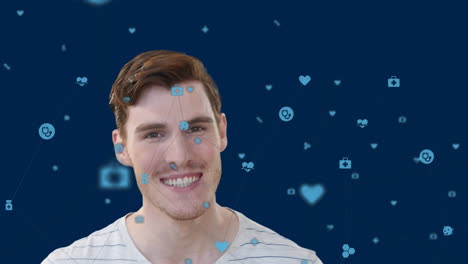 animation of blue media icons over portrait of smiling caucasian man on blue background