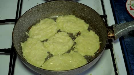 vegetable zucchini pancakes are fried in a pan