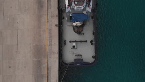 boats moored at harbor. aerial top-down forward