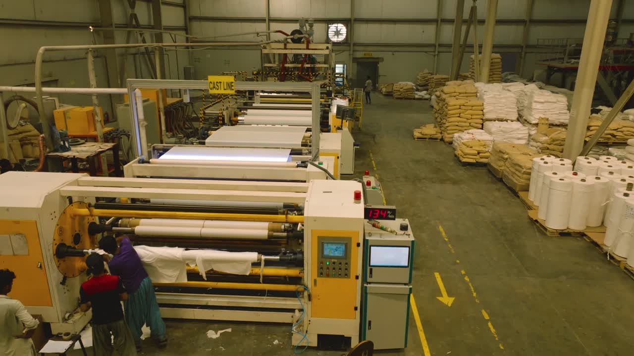 Workers working at textile factory, Top view