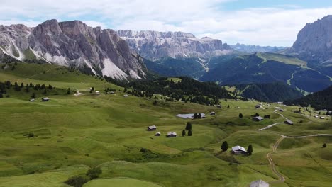 seceda and val gardena valley at south tyrol, italian alps, dolomites, italy - aerial drone view of the mountains and cabins