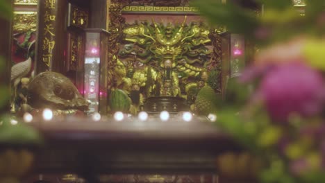 handheld shot of an altar in a buddhist temple