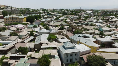 flying over istaravshan with dense houses in tajikistan - drone shot