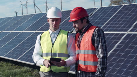 solar panel technicians reviewing data