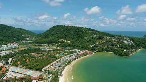 4k cinematic nature aerial footage of a drone flying over the beautiful beach of patong in phuket, thailand on a sunny day