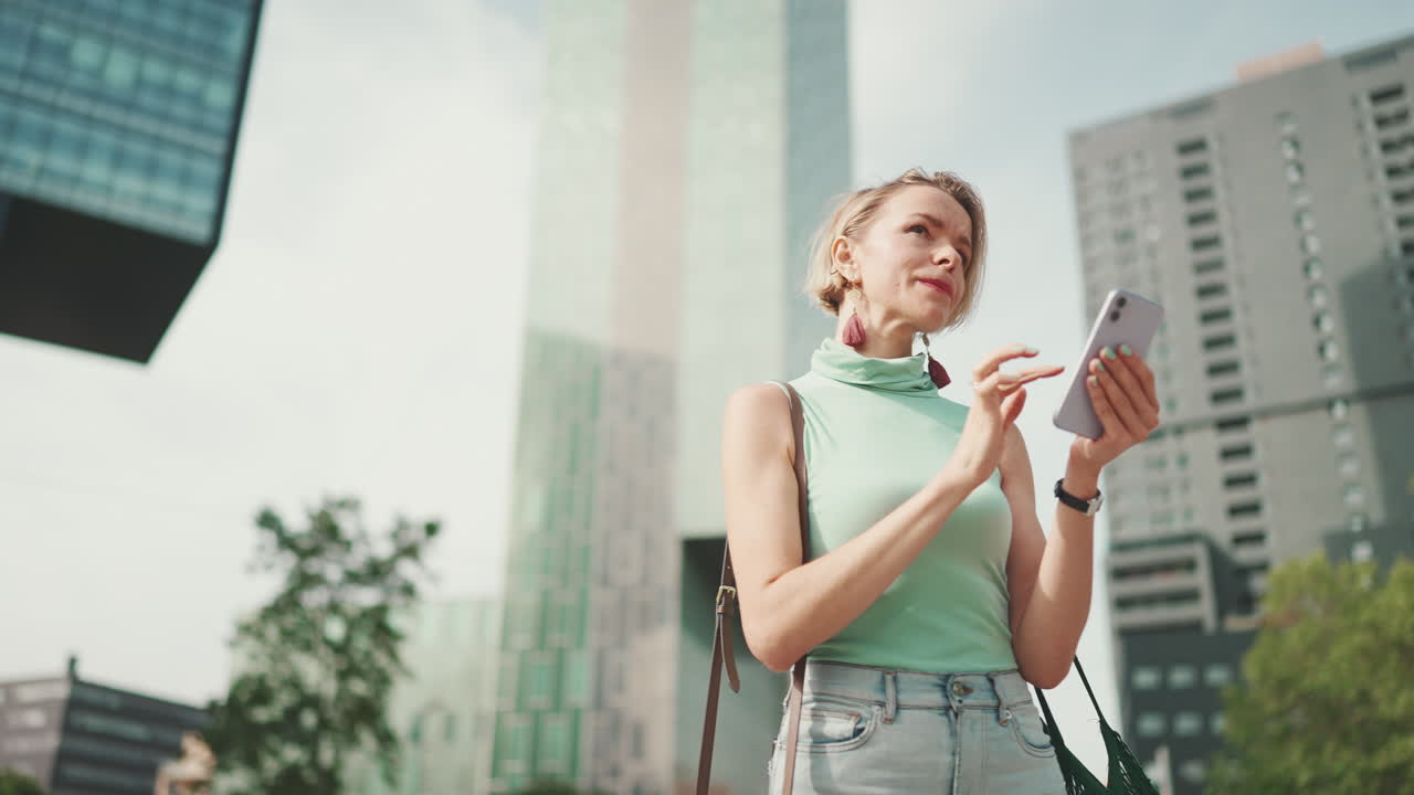 Woman using smartphone in an urban setting
