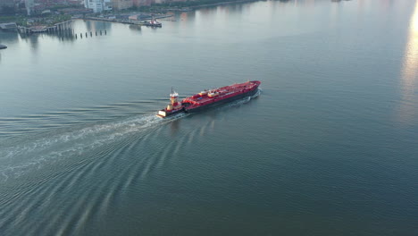 an aerial view over the hudson river with manhattan's westside in view at sunrise