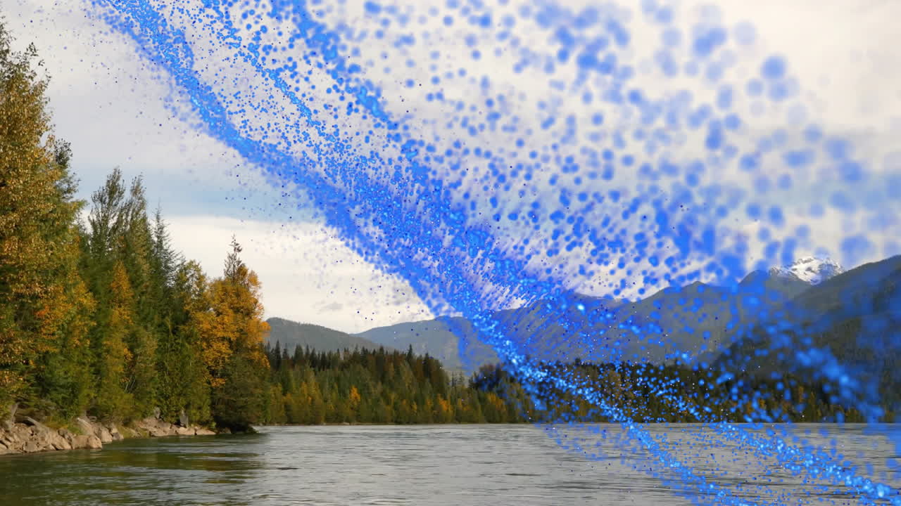 Swirling blue digital particle stream flowing over mountain riverside forest with autumn trees
