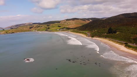 Kaka-Point-sandy-beach-look-up-aerial-shot