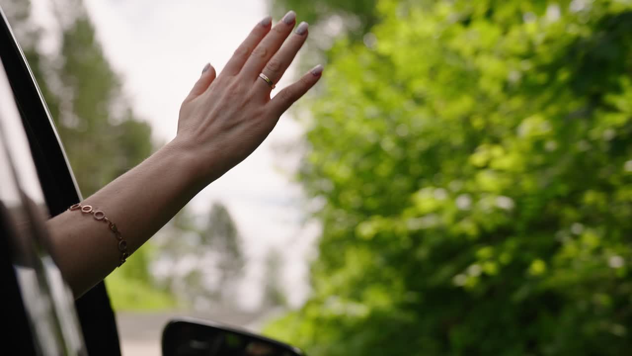 Woman enjoying a drive through the countryside