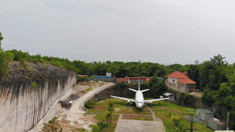 Aerial-footage-of-a-jet-airliner-on-a-small-aircraft-boneyard