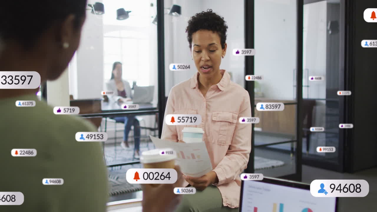 Three female coworkers presenting social media metrics in office, showing floating icons and chart