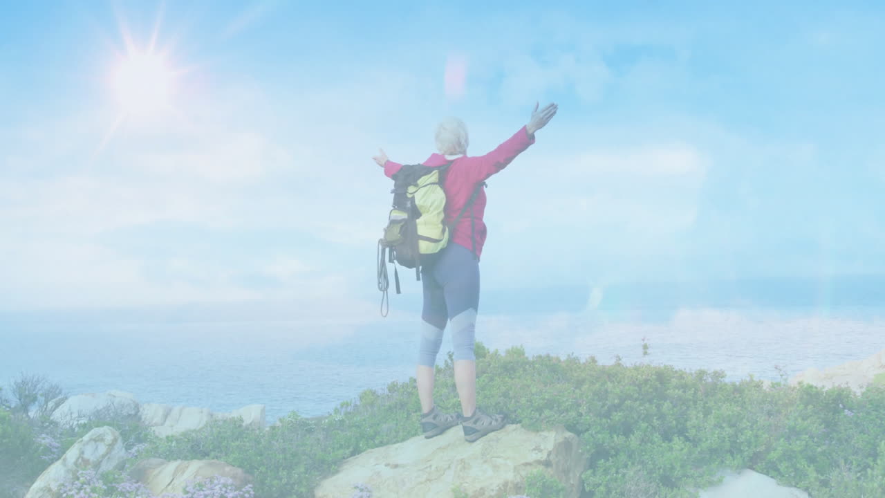 Mature woman hiking on coastal cliff, showcasing travel marketing with animated chart overlay