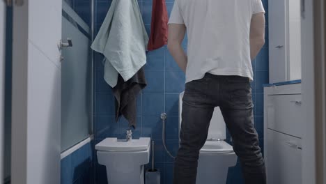 man standing in a bathroom