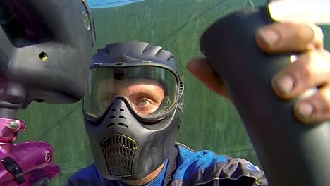 girls and boys playing paintball in an outdoor arena-3