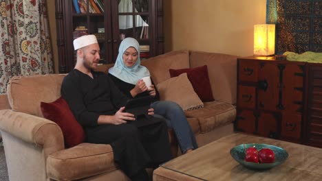 middle eastern young couple with digital tablet ws static